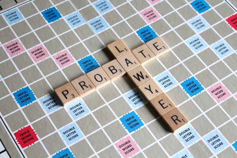 Scrabble tiles spelling PROBATE LAWYER on a Scrabble board.
